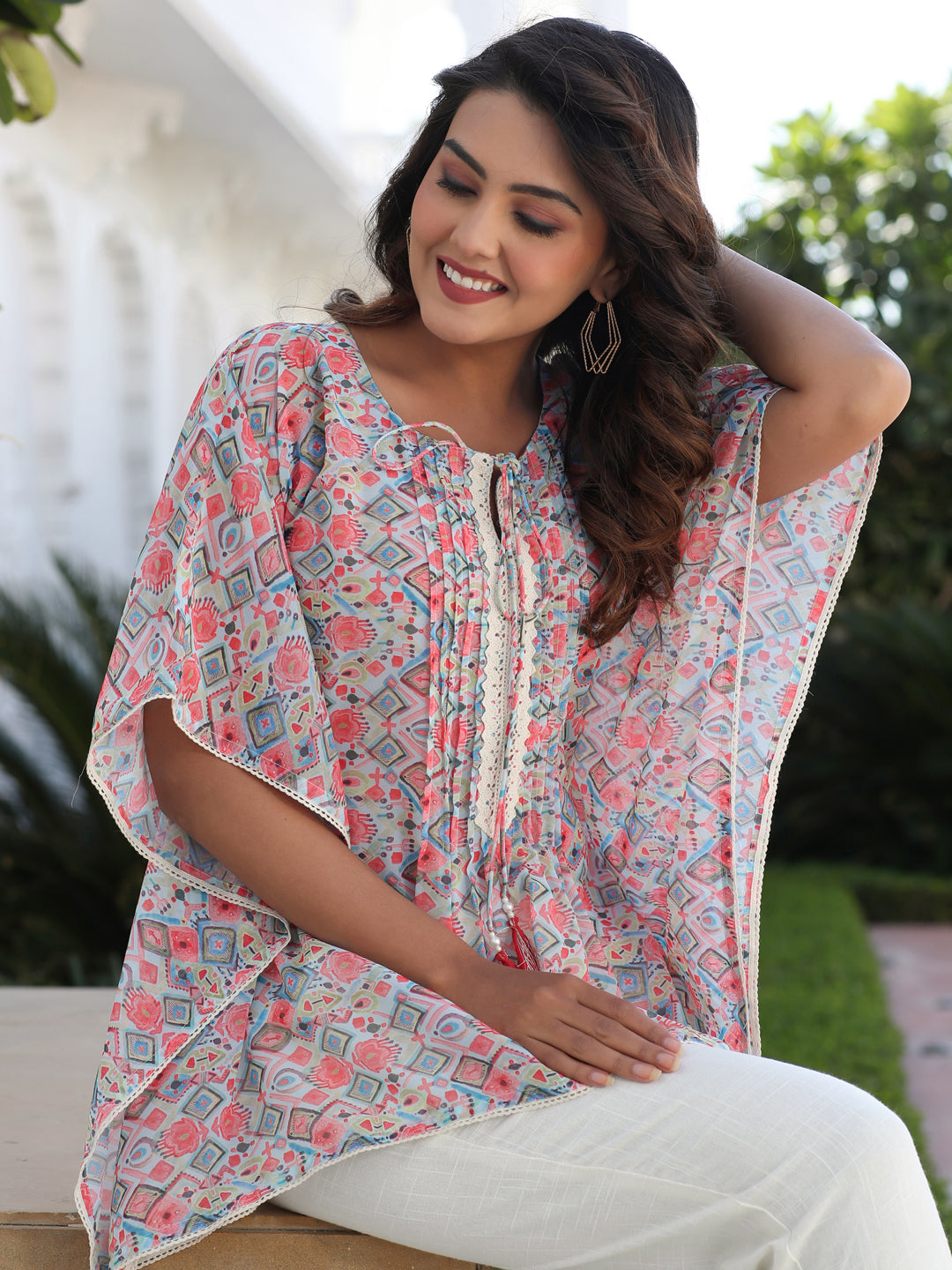 A Peach Geometric Printed Georgette Kaftan Top With Pintucks And Lace Details At The Yoke With Off- White Cotton Pants