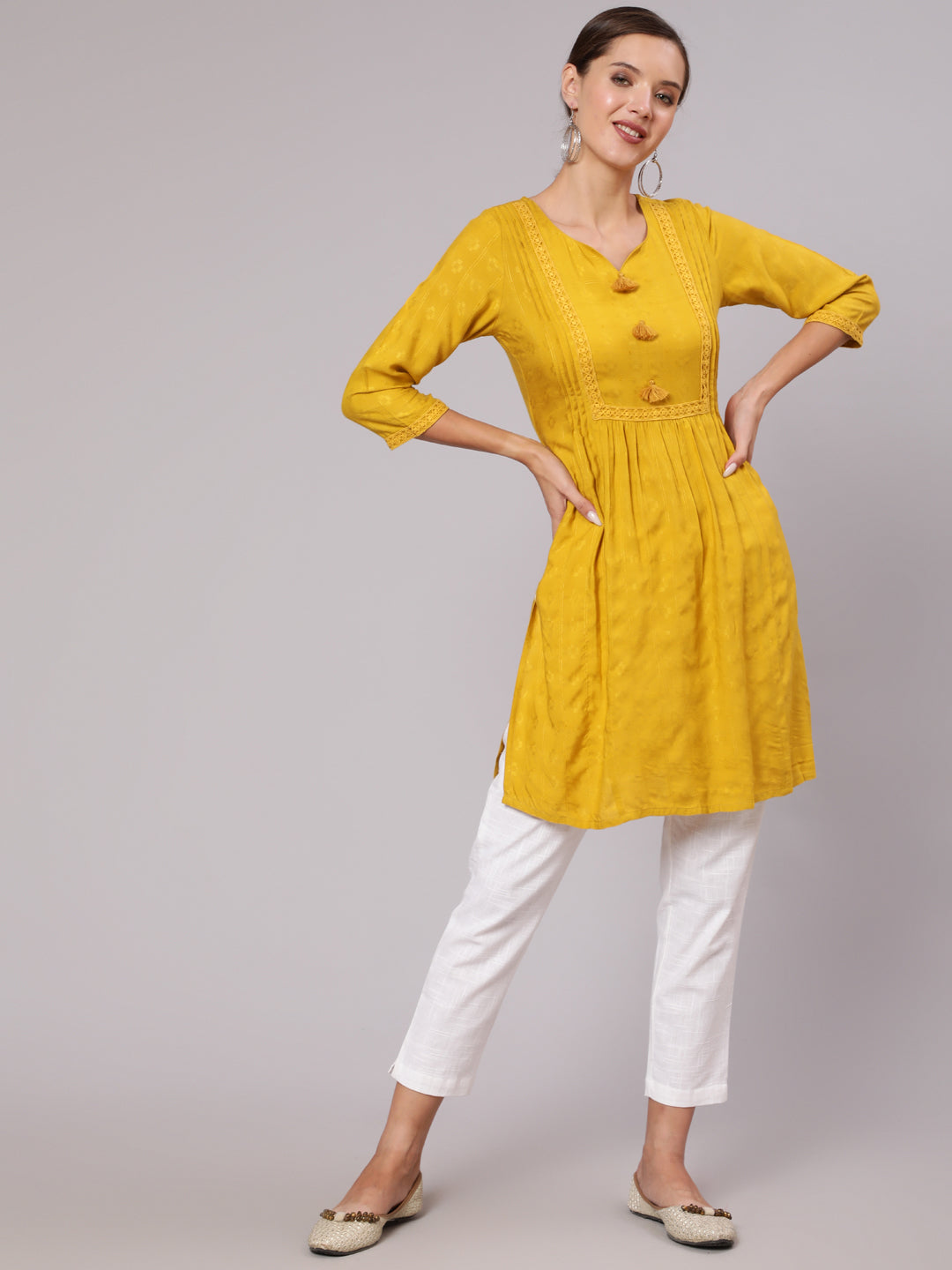 Mustard Self Weave Pleated, Laced-Up And Gathered Short Kurta With Tassels