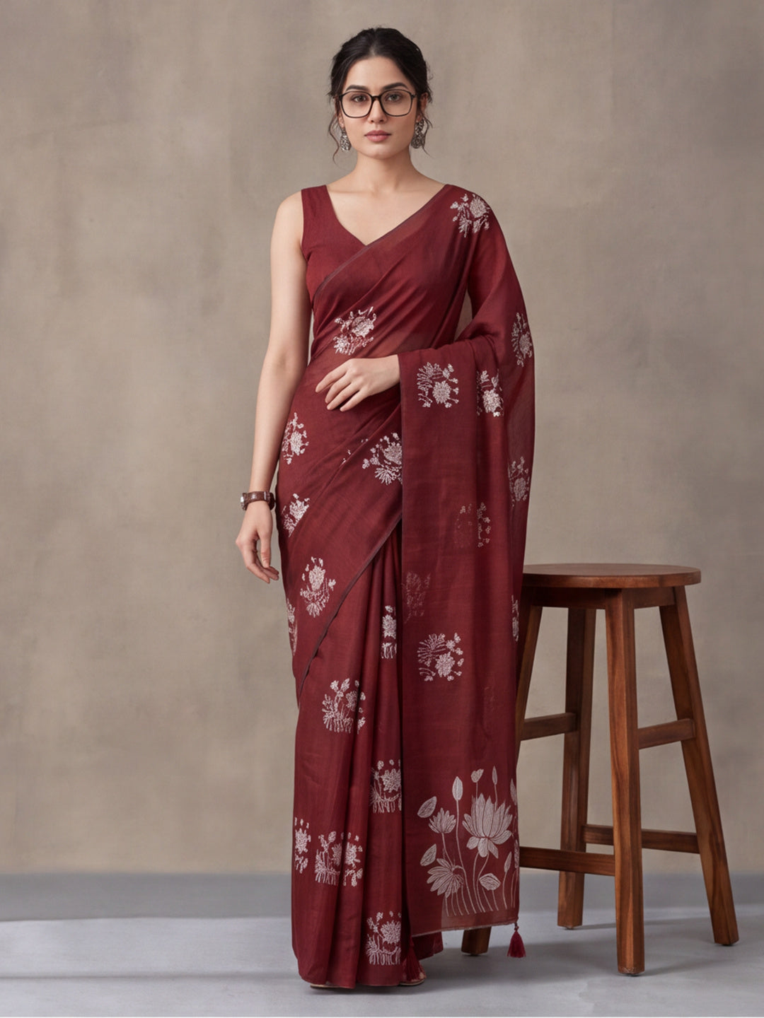 Women Maroon Floral Woven Design Saree with Tassel Detail Pallu