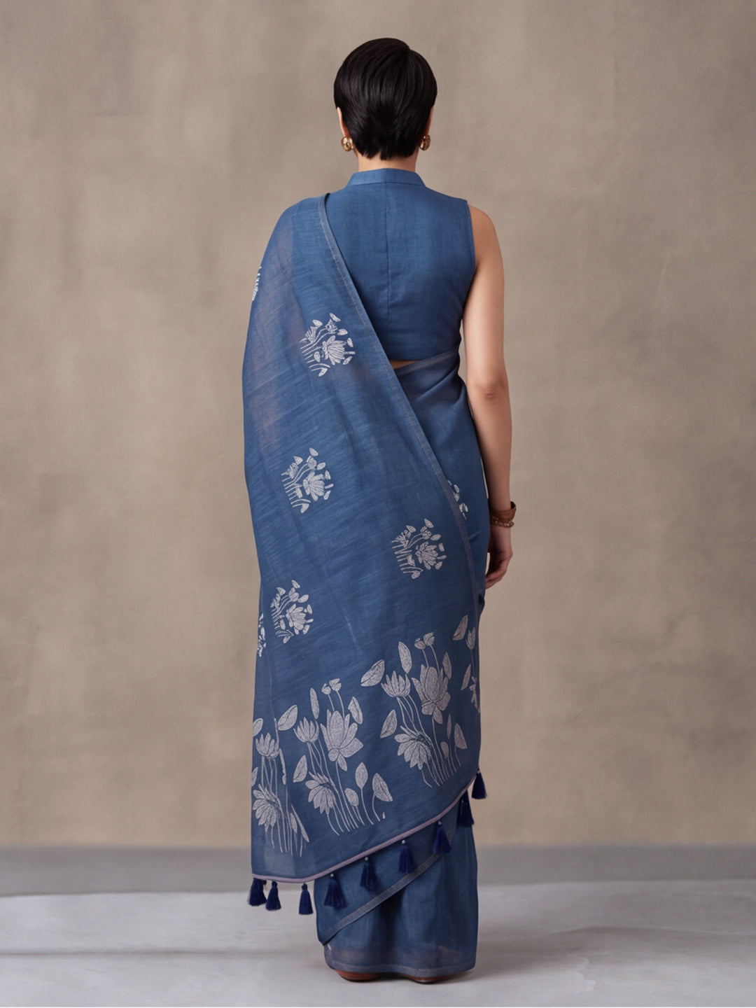 Women Blue Floral Woven Design Saree with Tassel Detail Pallu