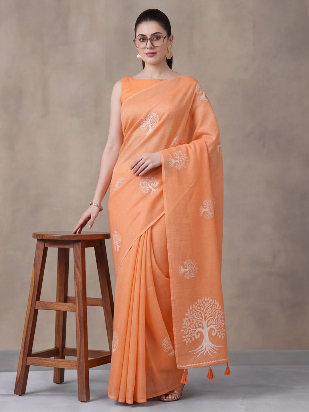 Women Peach Ethnic Tree Print Saree with Tassel Pallu and Artistic Design