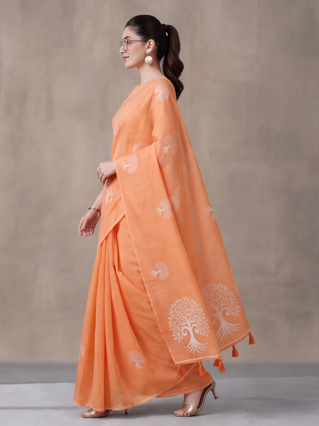 Women Peach Ethnic Tree Print Saree with Tassel Pallu and Artistic Design