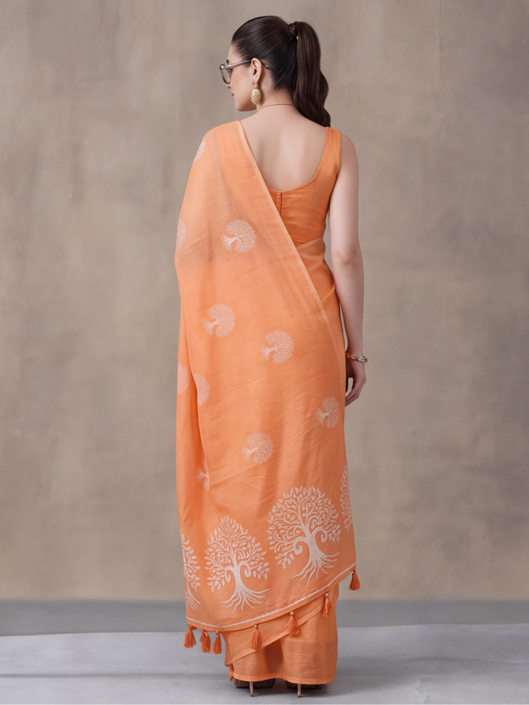 Women Peach Ethnic Tree Print Saree with Tassel Pallu and Artistic Design