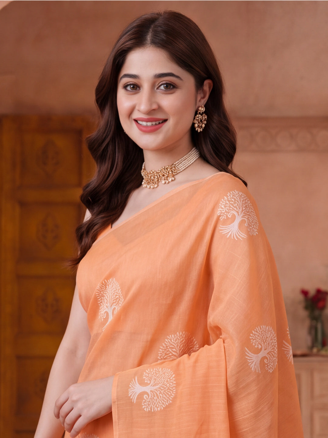 Women Peach Ethnic Tree Print Saree with Tassel Pallu and Artistic Design