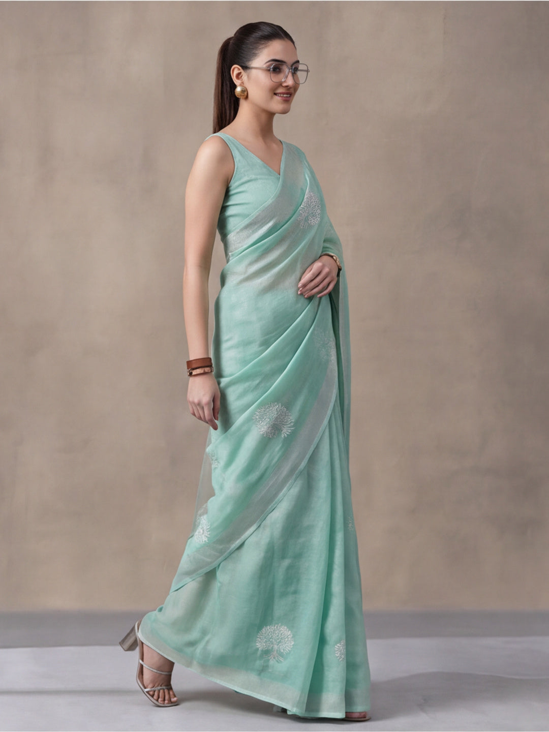 Women Sea Green Ethnic Tree Print Saree with Tassel Pallu and Artistic Design