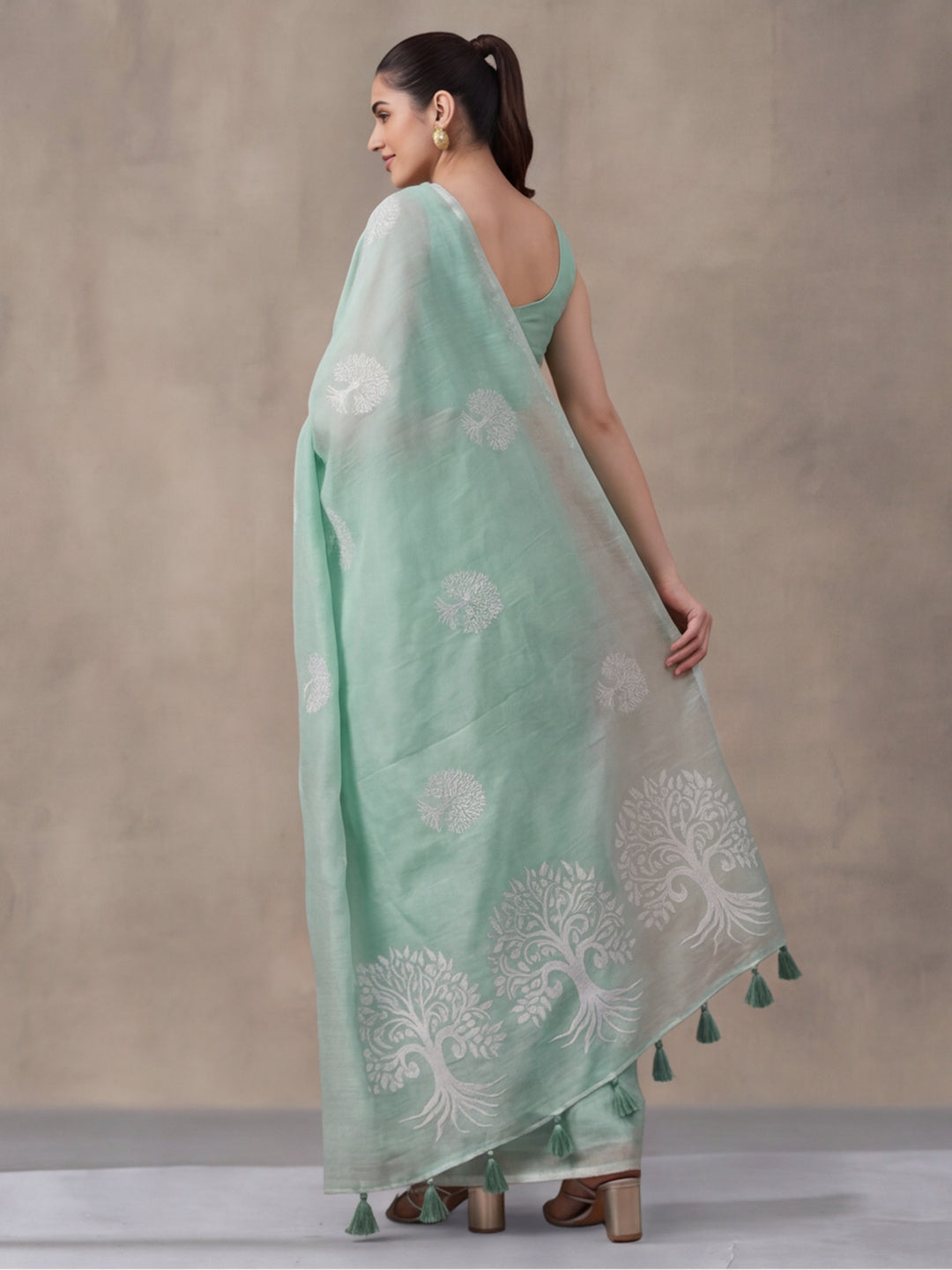 Women Sea Green Ethnic Tree Print Saree with Tassel Pallu and Artistic Design