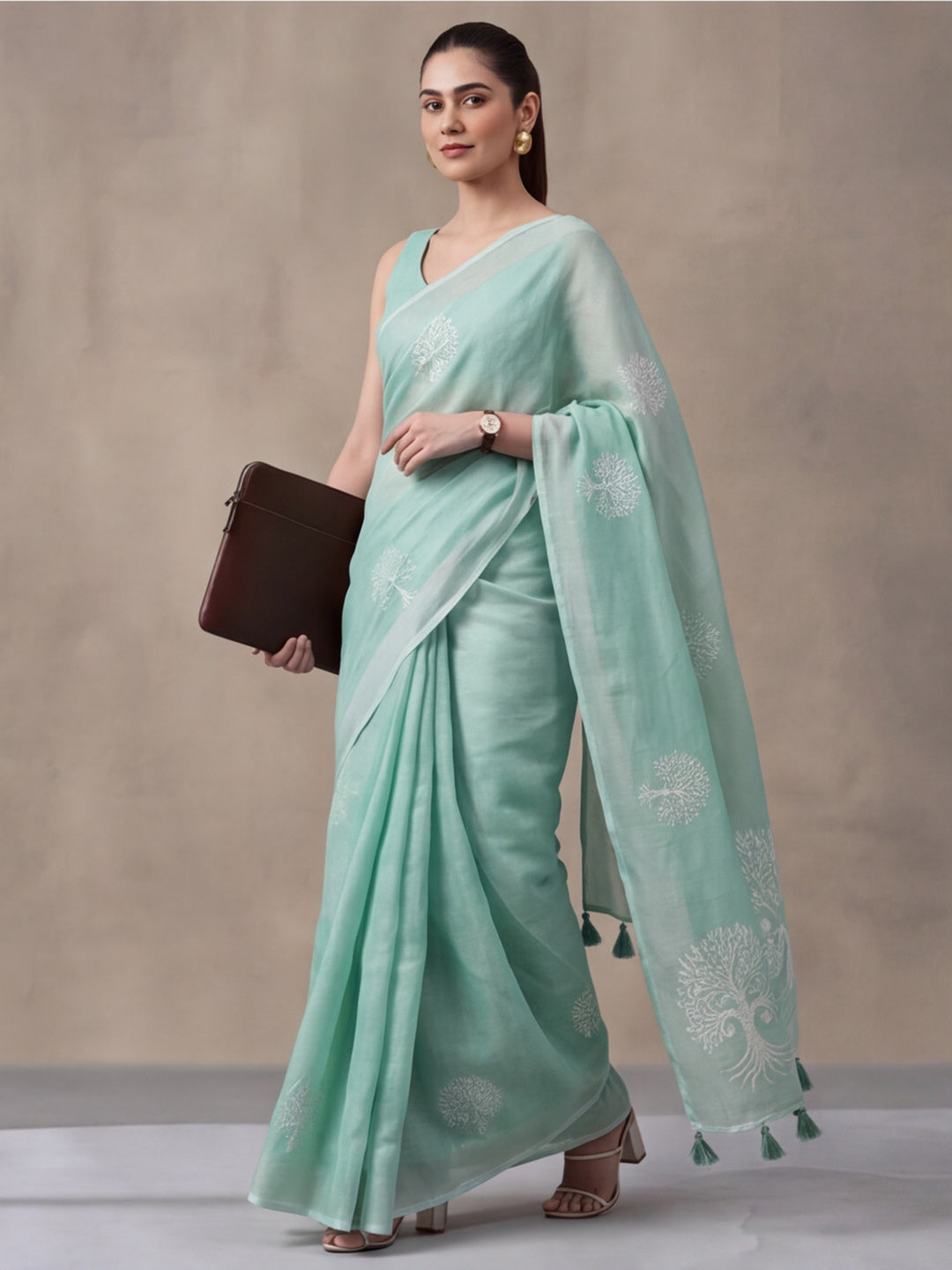 Women Sea Green Ethnic Tree Print Saree with Tassel Pallu and Artistic Design