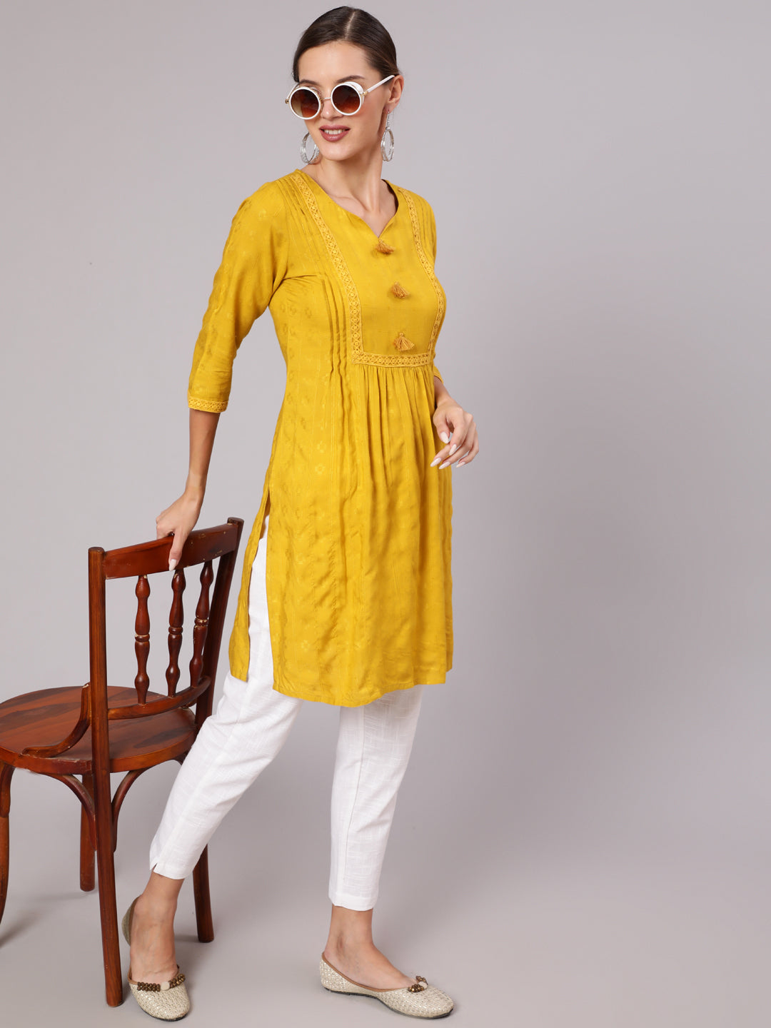 Mustard Self Weave Pleated, Laced-Up And Gathered Short Kurta With Tassels