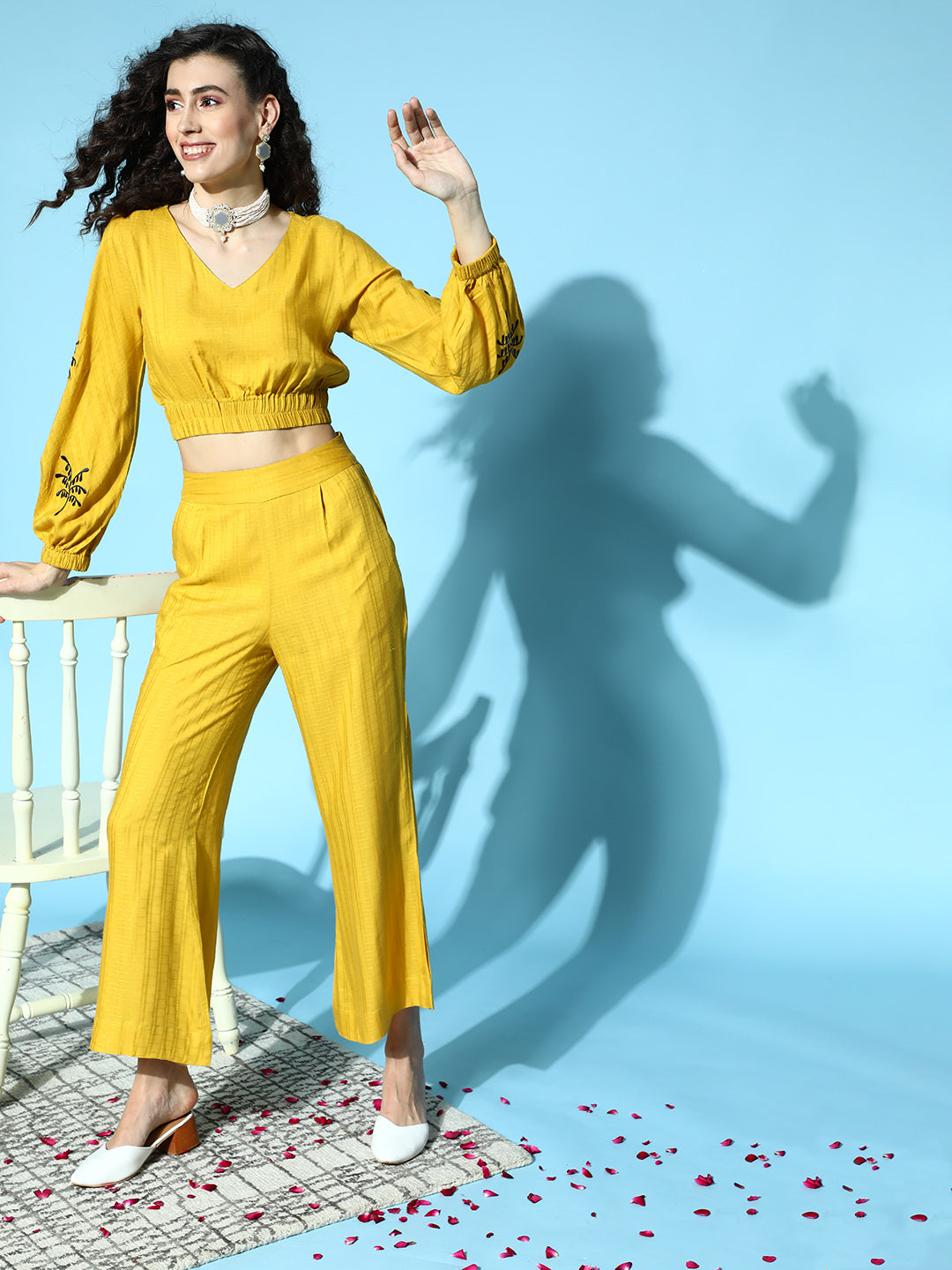 Women Mustard Self Weave Rayon Co-ords Set Has Crop Top With Round Neck, Elastic At Waistline, Gathers All Over At Waist, Full Sleeves Has Elastic At The Hem, Thread Embroidery At Sleeves, Mustard Palazzo Has Flared Hem With Side Slit, Both Side Pocket And Partially Elastic At Waistline