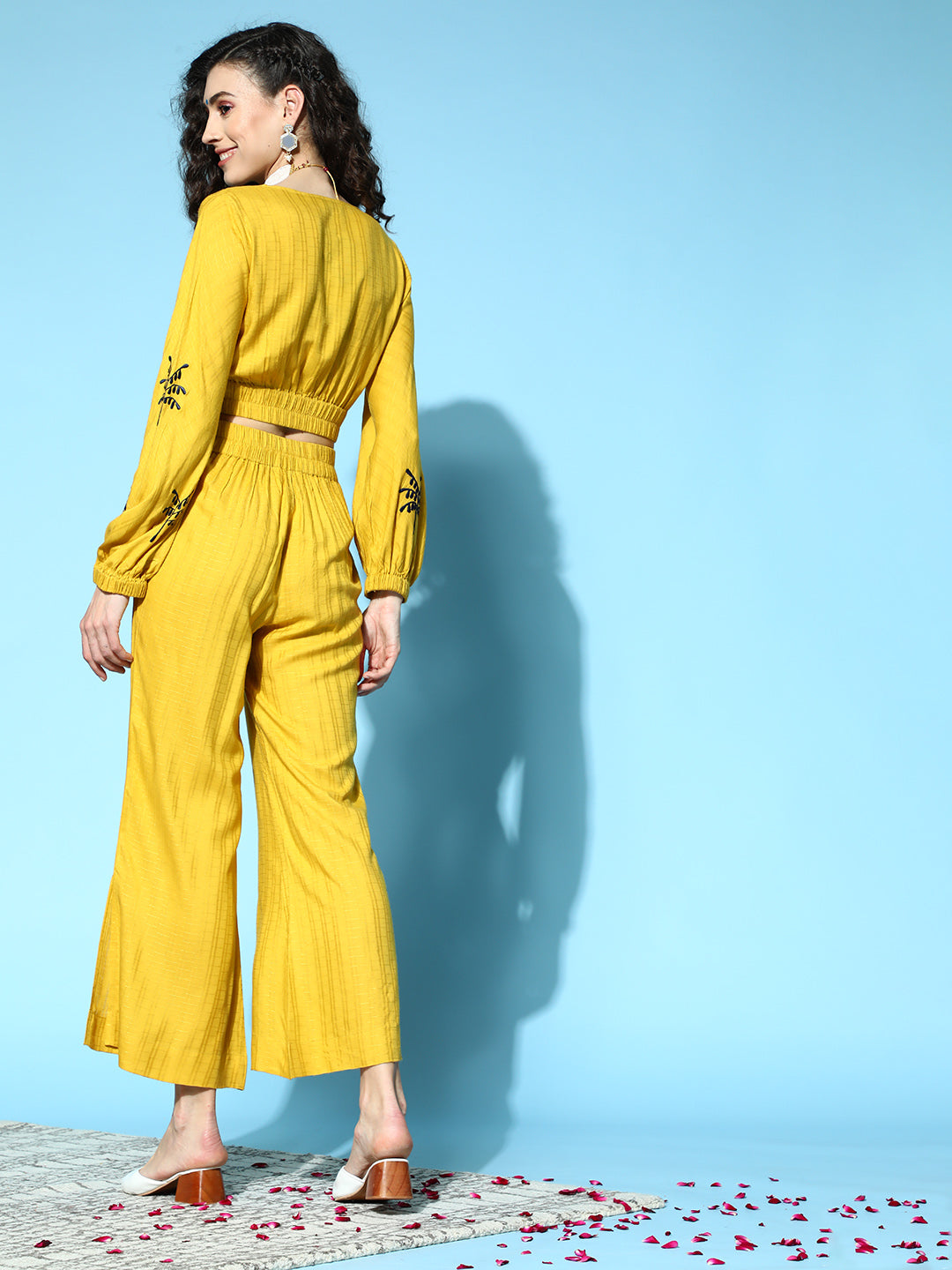 Women Mustard Self Weave Rayon Co-ords Set Has Crop Top With Round Neck, Elastic At Waistline, Gathers All Over At Waist, Full Sleeves Has Elastic At The Hem, Thread Embroidery At Sleeves, Mustard Palazzo Has Flared Hem With Side Slit, Both Side Pocket And Partially Elastic At Waistline